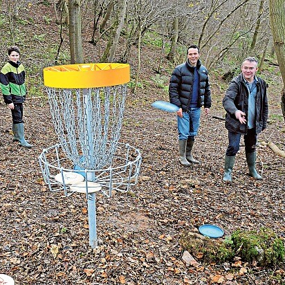 A family playing our Frisbee Golf game at youth group event.