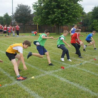 Children at a school sports day racing with our beanbags.