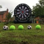 Our Giant Inflatable Darts set up with footballs for an outside event.