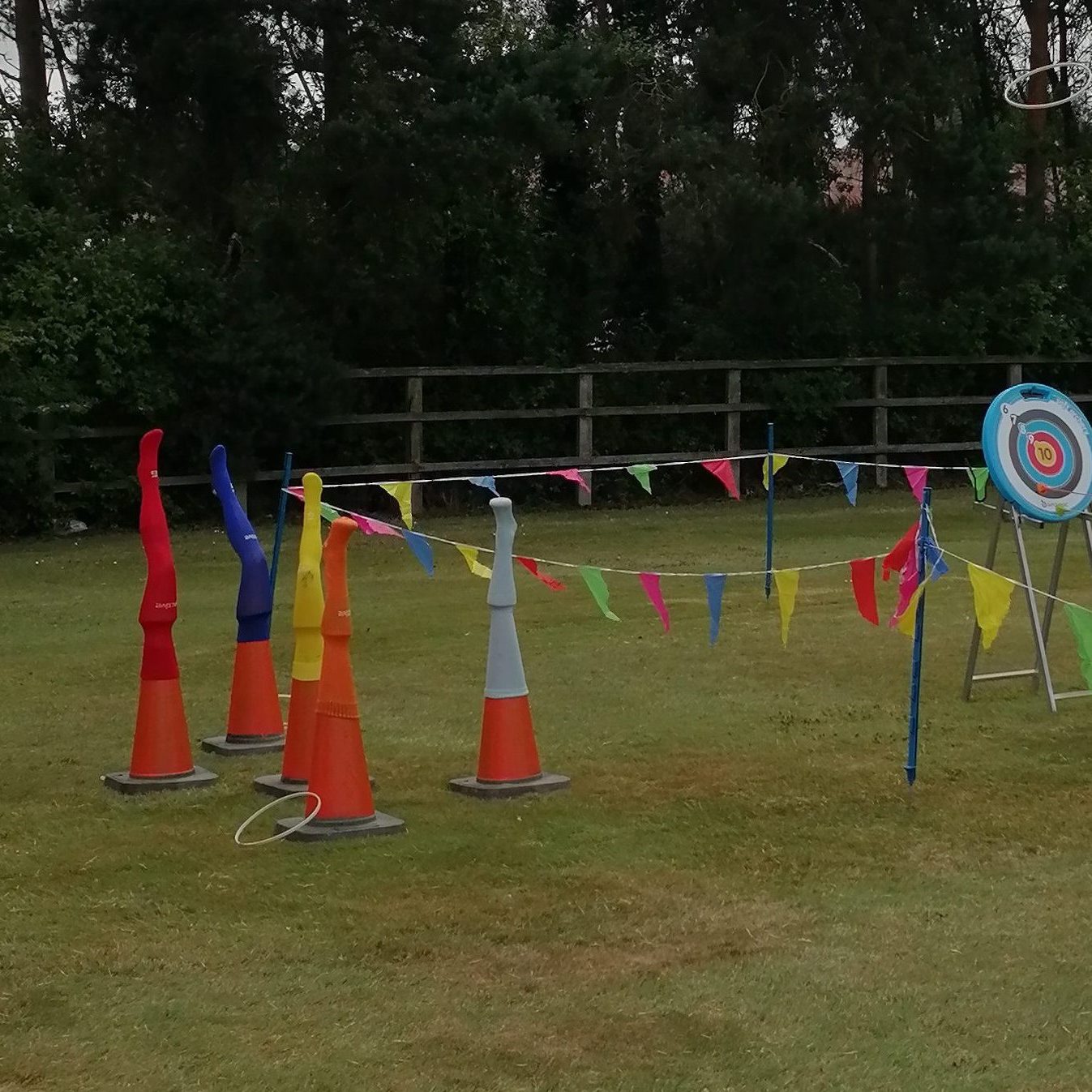 Our classic Giant Hoopla game for hire with our sturdy cones, plastic legs, multi-coloured football socks and bright bunting.