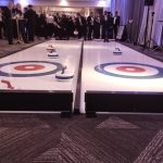 Our Big Impact Curling lane for hire with office workers enjoying a go.