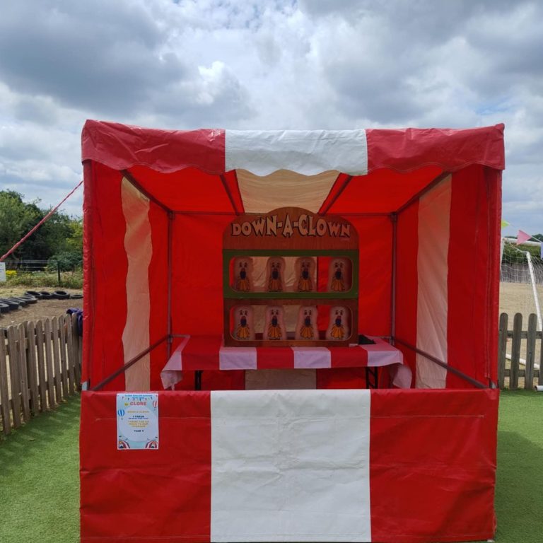 Our vibrant red and white Carnival Side Stall with our Down a Clown game.