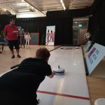 Someone knelt down to competitively play on our hired in Curling Lane.
