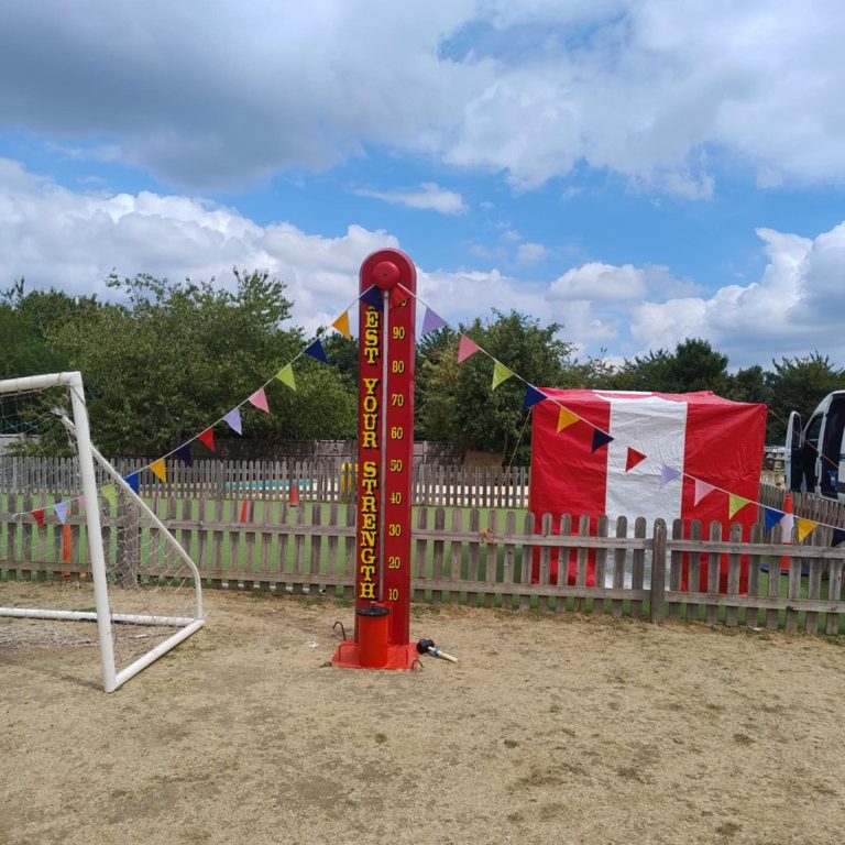Our bright red and gold High Striker/ Test your Strength game set up ready for play.