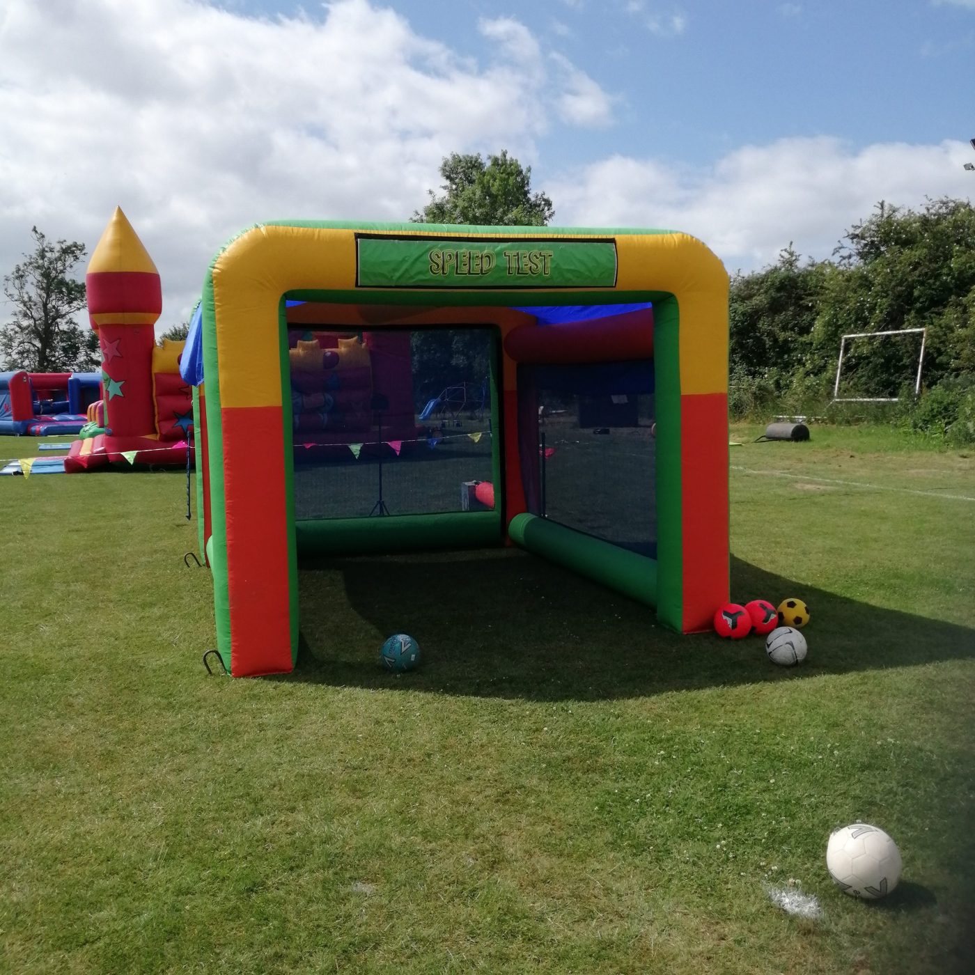 Our multi-coloured Inflatable Speed Cage set up with our speed radar gun, ready for a Sports event.