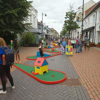 Our Crazy Golf with brightly painted obstacles set up on a town centre pedestrian zone for a Council Run "free to the public" event.