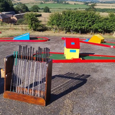 A snapshot of a Home Fete Event with our Crazy Golf and bespoke handmade Golf Club and Golf Ball holder.