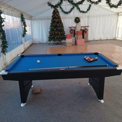 Our Pool Table set up ready for an indoor festive event with a Christmas tree in the background.