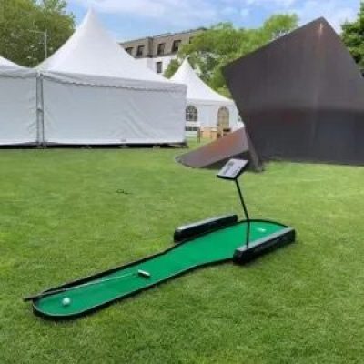 Our Electronic Golf Putting Machine on grass, set up ready for action at a local Village Fete.