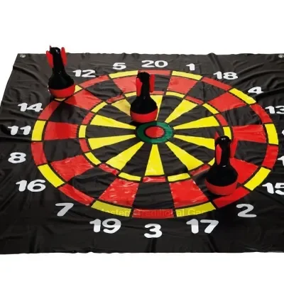 The target mat and lawn darts set out ready for people to play the classic garden game of Lawn Darts.