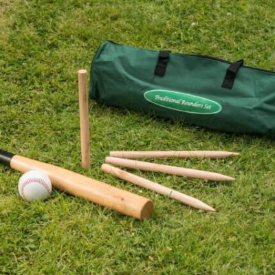 The traditional game of Rounders set out neatly, with the ball, pegs and bat.
